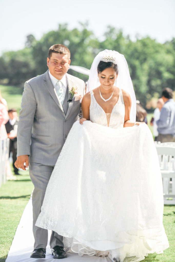 Bride and groom walk back down the aisle after being pronounced husband and wife