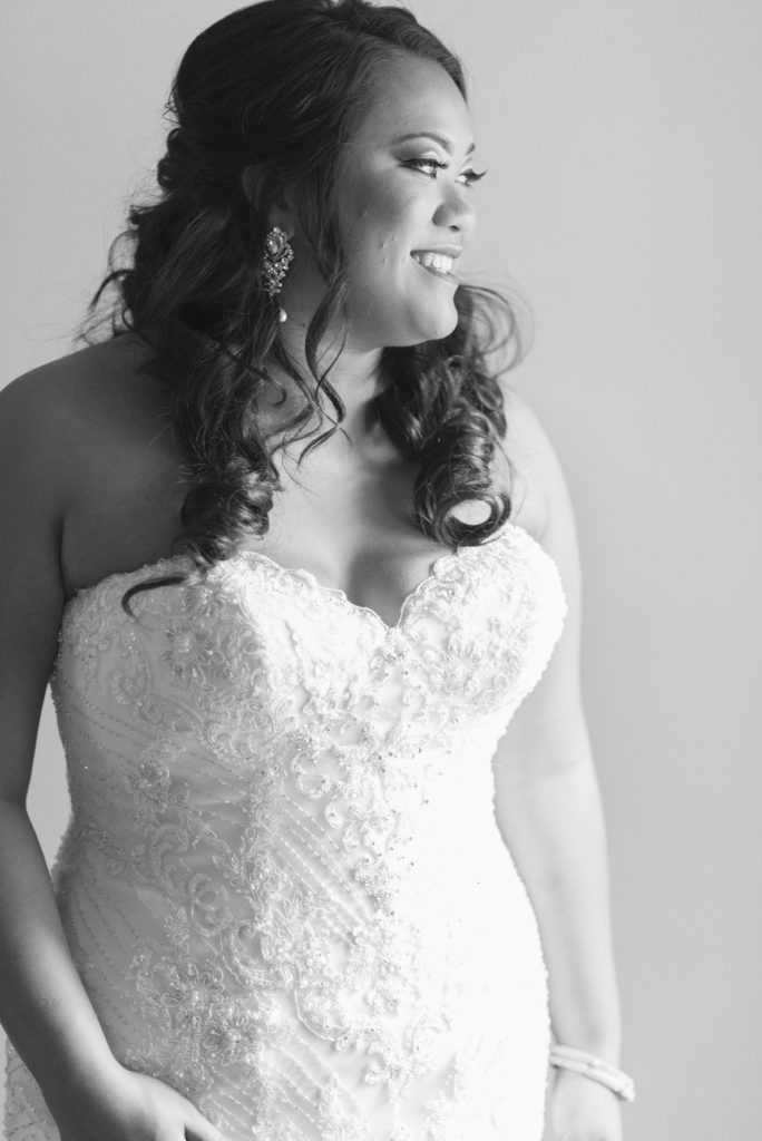 Bride poses for a portrait after getting ready for her wedding