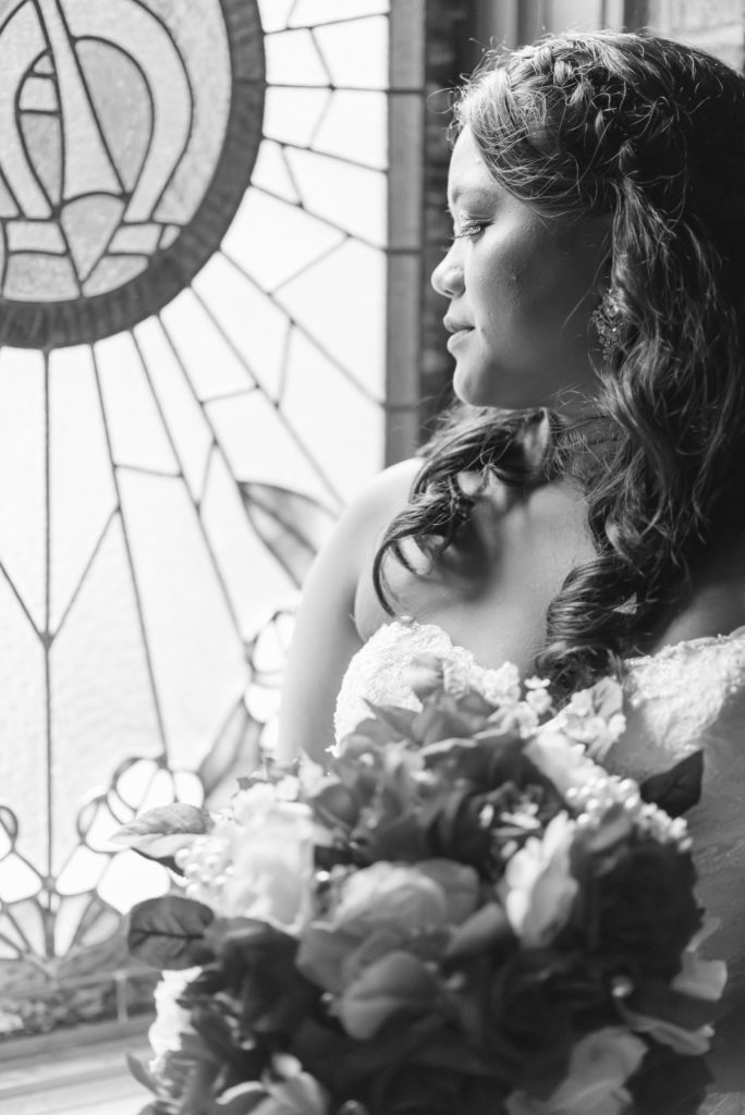 Bride poses for a portrait after getting ready for her wedding