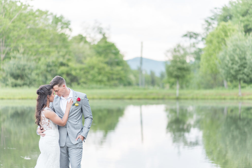 bride and groom portrait by the pond at their Hemlock Barn wedding in NC