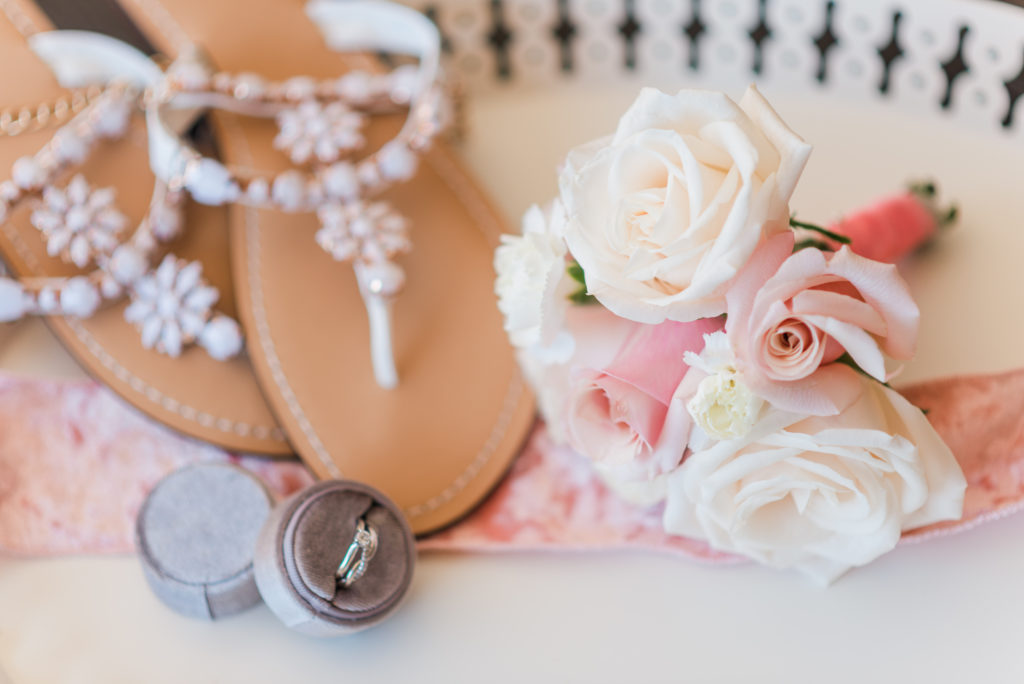 bridal details; wedding rings, bride's shoes, and bridal bouquet