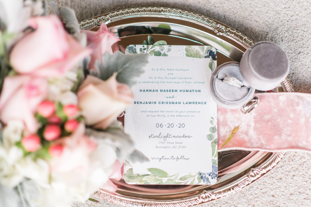 bridal details; bride and groom rings, invitation, bridal bouquet