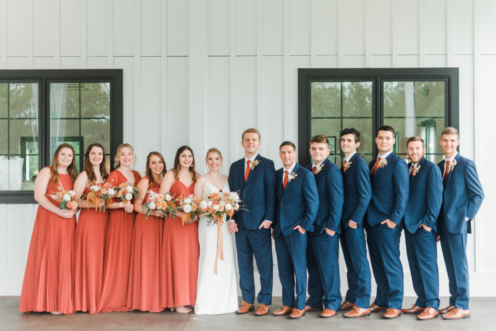 Terra Cotta and Navy bridal party at an autumn wedding