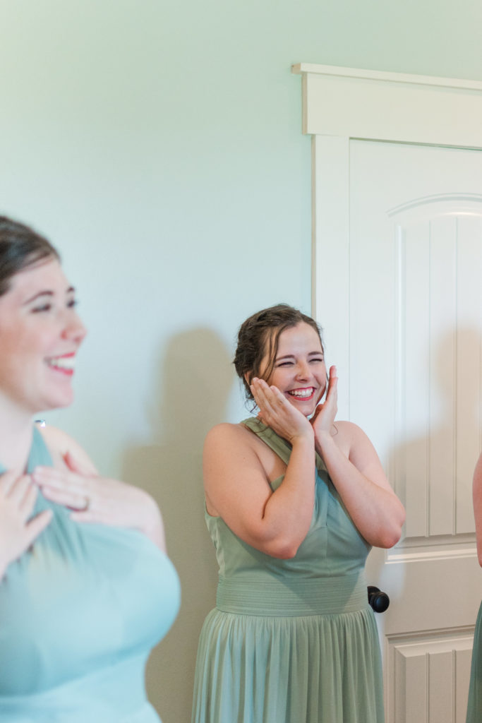Bridesmaids react to seeing bride