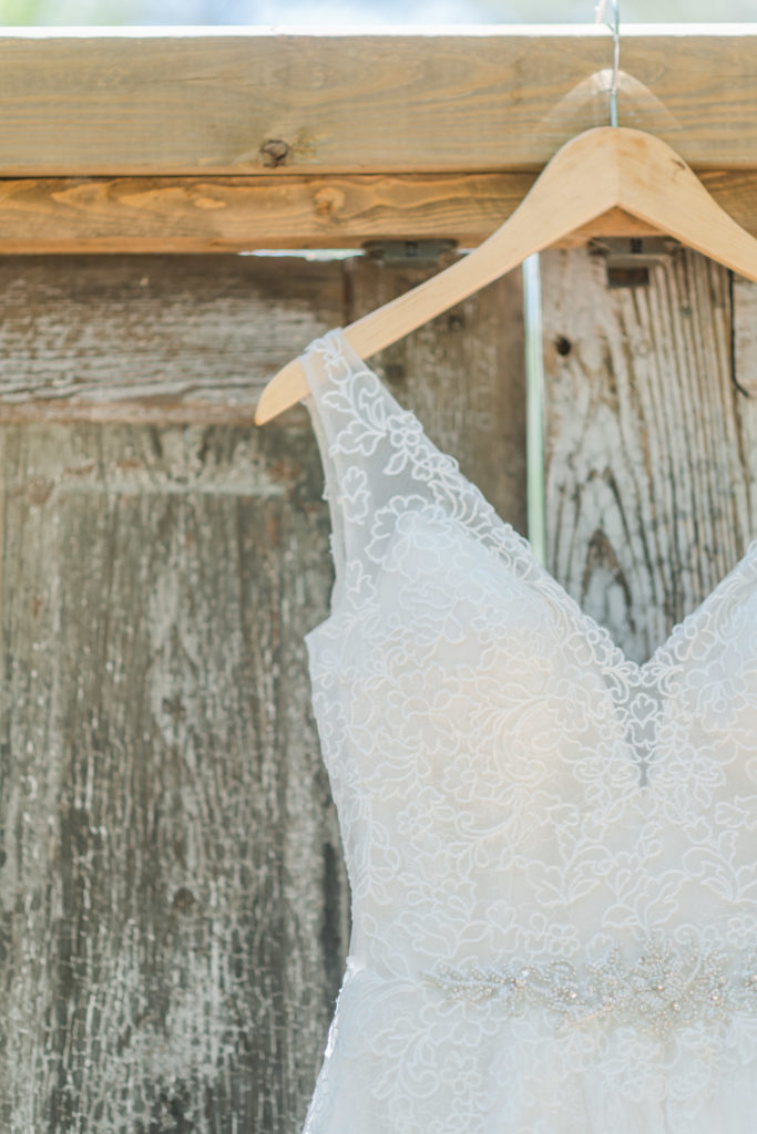 Lace bridal gown worn at a gorgeous summer wedding at Splendor Pond near Charlotte, NC.
