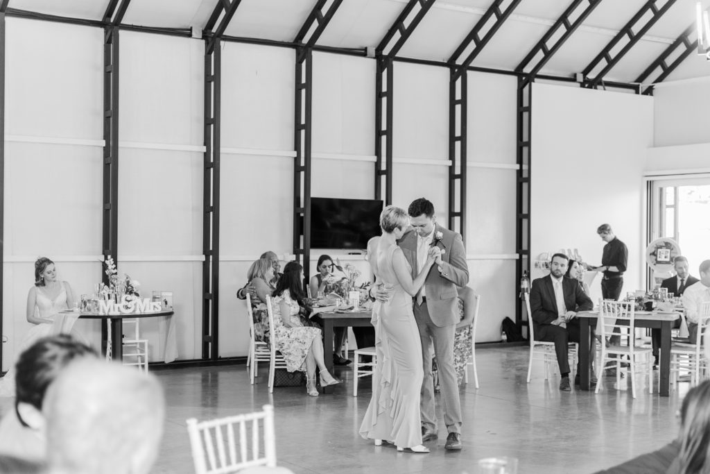 Groom and mother of the groom share their first dance at their wedding reception at Splendor Pond wedding